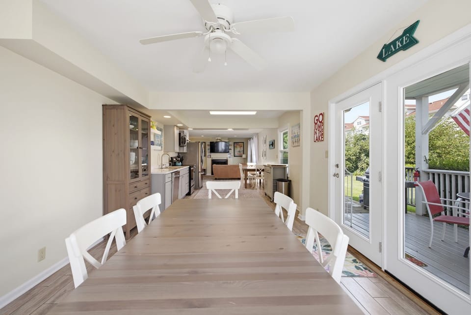 Spacious dining area with seating for six and easy access to the kitchen and outdoor spaces.