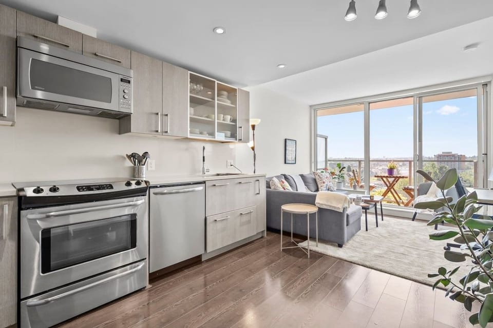 Living Room: Enjoy stunning views from this chic open space with sleek furnishings and natural light!