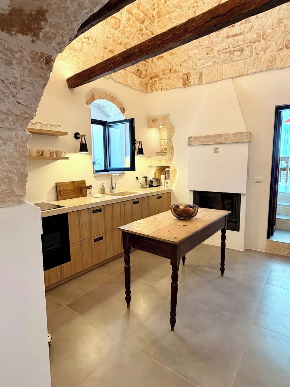 Kitchen with oven, cooktop and wooden work table