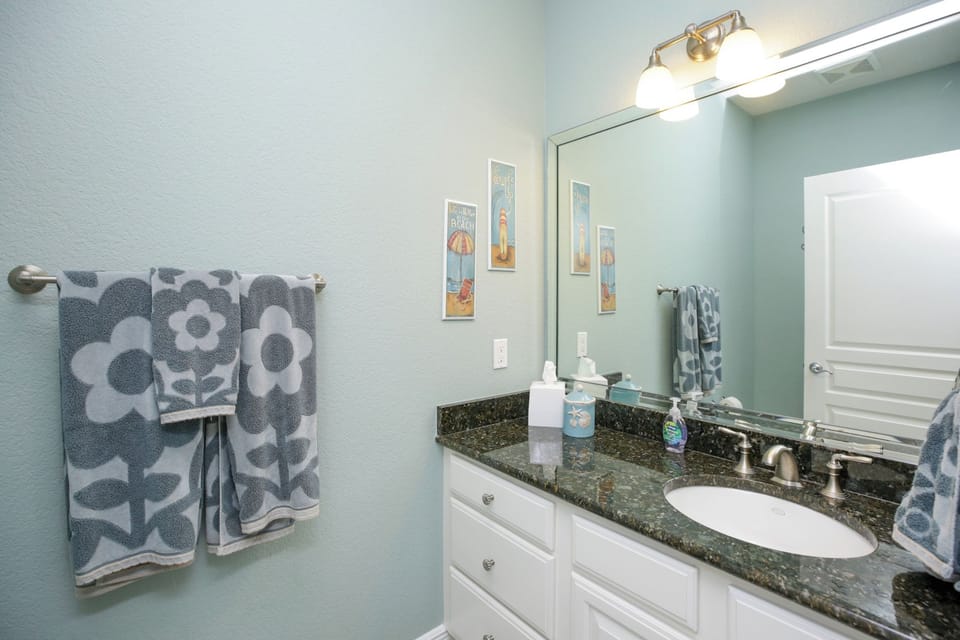 Convenient half bathroom located on 2nd/main floor accessible from the hallway