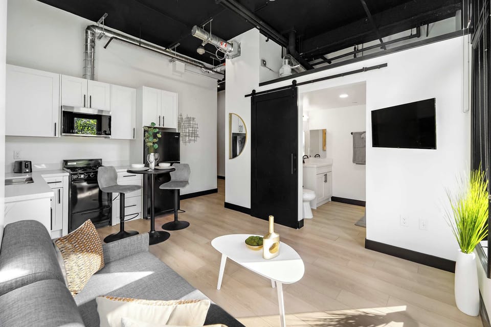 🛋️ Murphy bed up, lounge space ready—an adaptable studio that shifts easily from living room to bedroom.