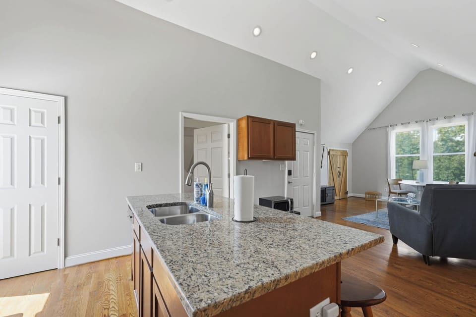Kitchen: This inviting kitchen offers a functional layout, ample prep space, and convenient essentials for everything from morning coffee to relaxed dinners at home.
