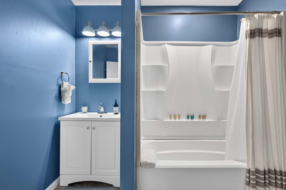 Full Bathroom 2: This bright and functional full bathroom offers a clean, convenient space for freshening up, getting ready for the day, or relaxing after a day of activities.