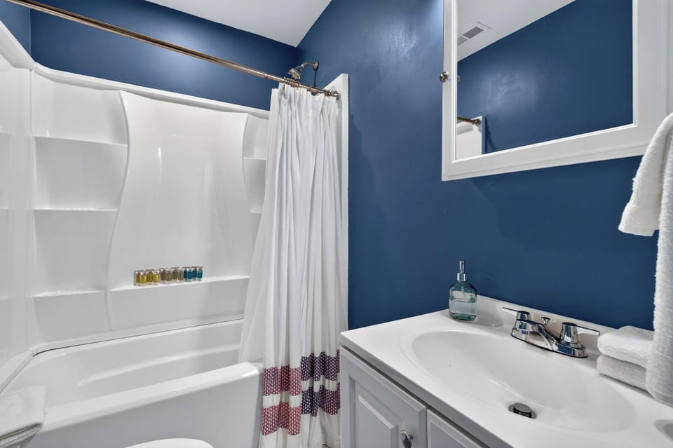 Full Bathroom 1: Start and end your day comfortably in this inviting full bathroom, offering a clean, functional setup with everything needed for a convenient and relaxing stay.