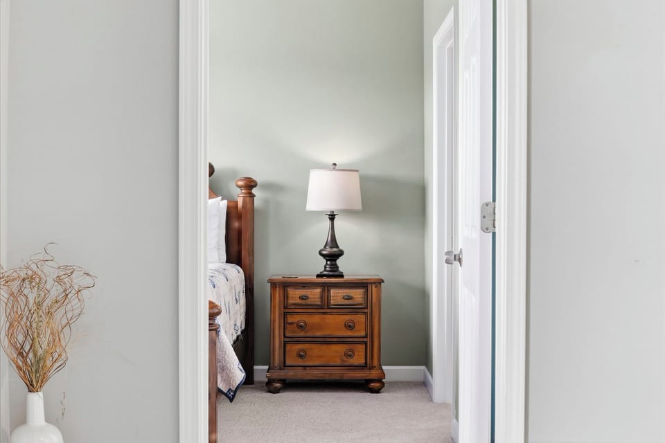 Settle in for a quiet night with a bedside reading lamp and convenient storage drawers.