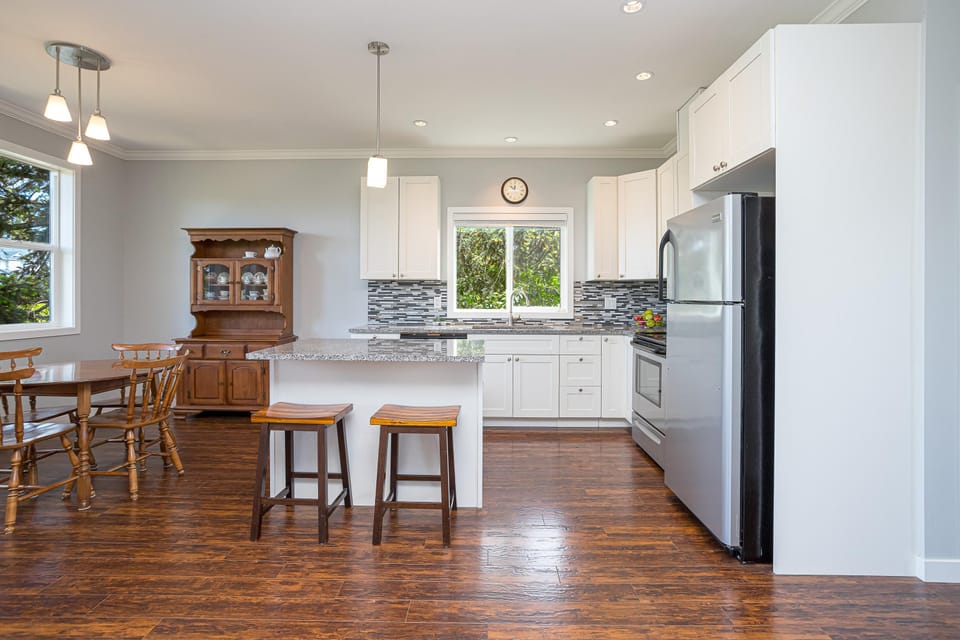 Fully equipped chef's kitchen featuring a center island and premium appliances, ideal for preparing home-cooked meals.