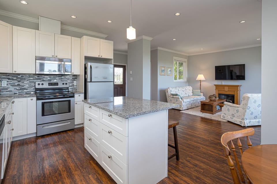 Generous kitchen island offering additional meal prep space and casual counter seating.