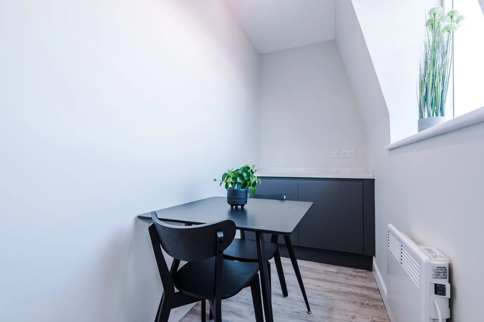 A comfortable sitting area with a table and chairs for relaxing or dining.
