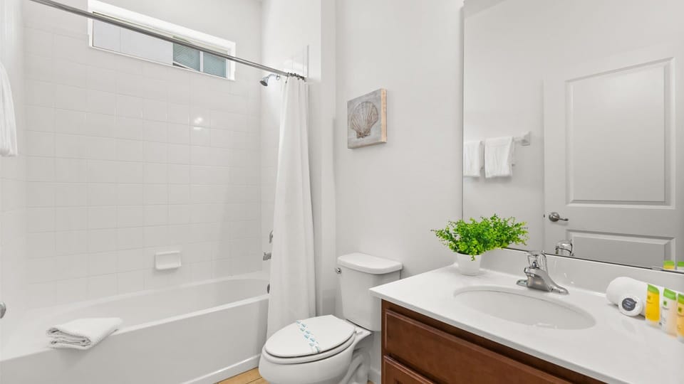Relax with a warm bath or a quick shower in this pristine ensuite bath complete with full amenities.