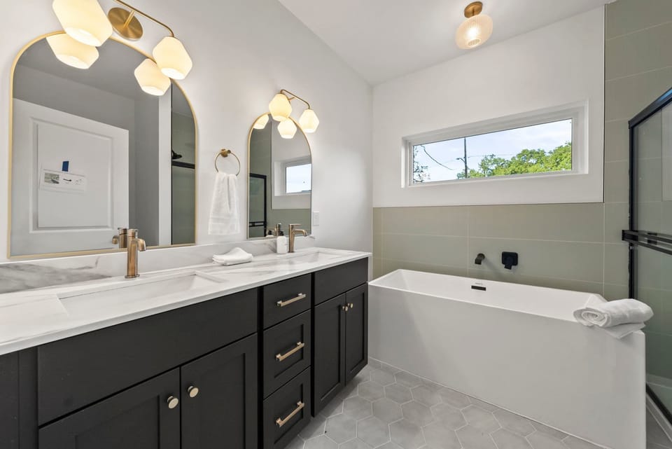 Double vanity with dark wood cabinetry