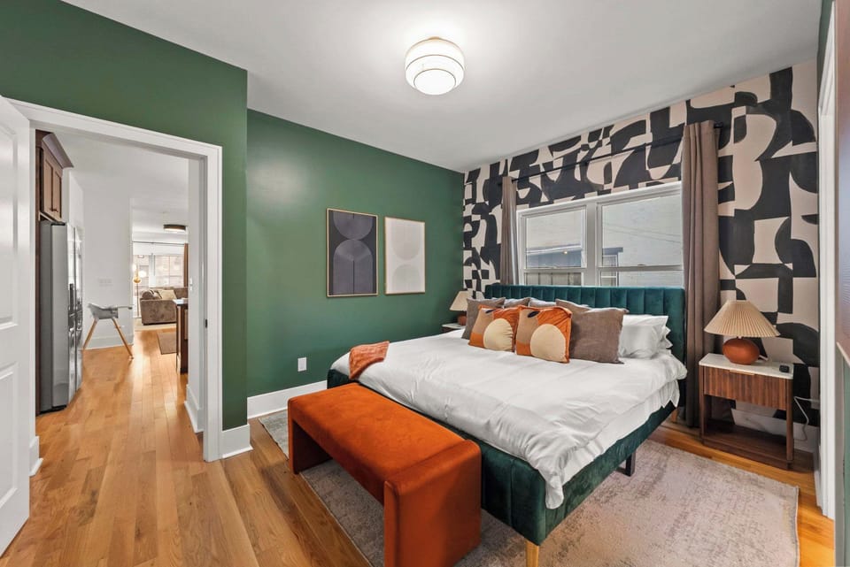 Warm bedroom with patterned accent wall