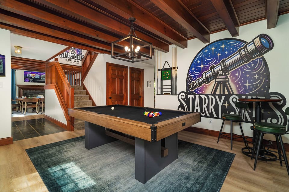 🎱 The billiards room, under the original beamed ceiling — with our hand-painted Starry Skies mural.