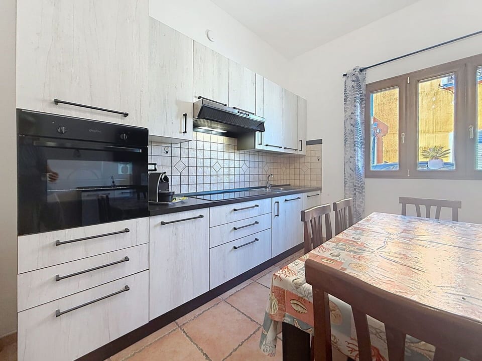 Kitchen, Countertop, Flooring, Kitchen Appliance, Major Appliance, Interior Design, Cabinetry, Floor, Room, Home