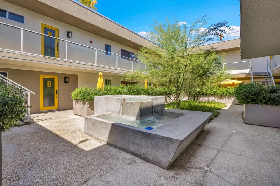 Landscaped courtyard with a modern water feature