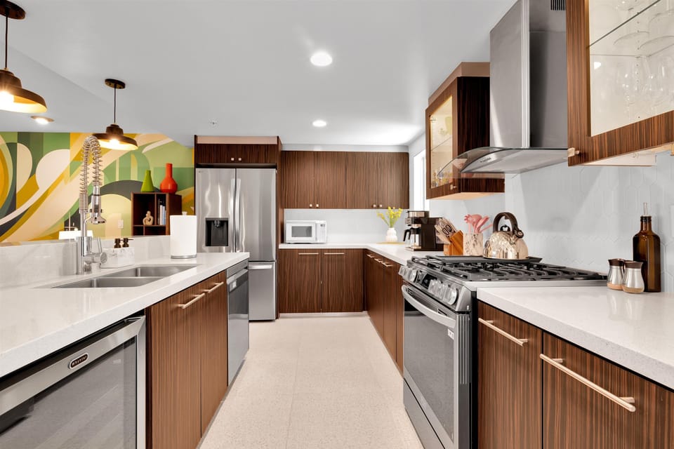 Updated kitchen with stainless appliances and ample cabinetry
