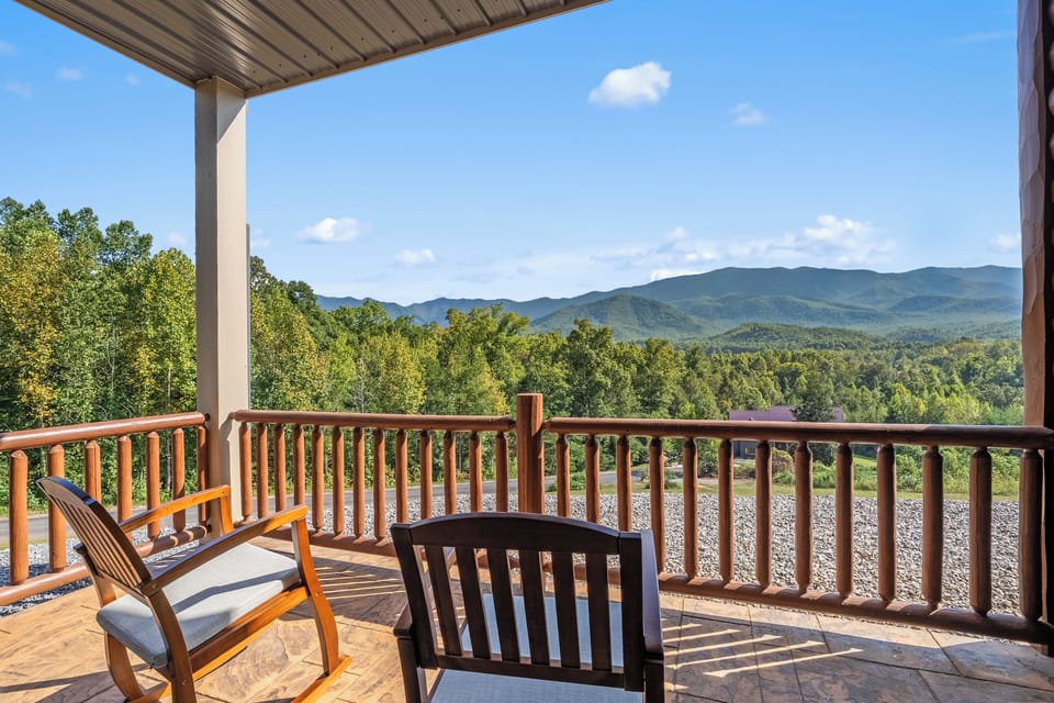 Covered mountain-view porch with peaceful seating and stunning scenery