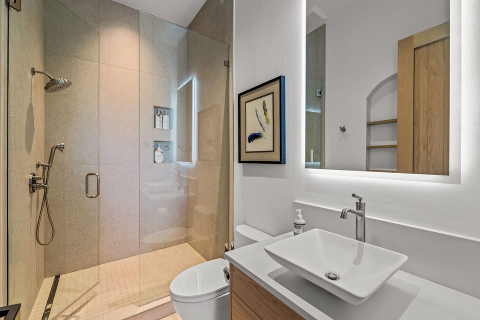 Entry level king bedroom bathroom with large walk in shower