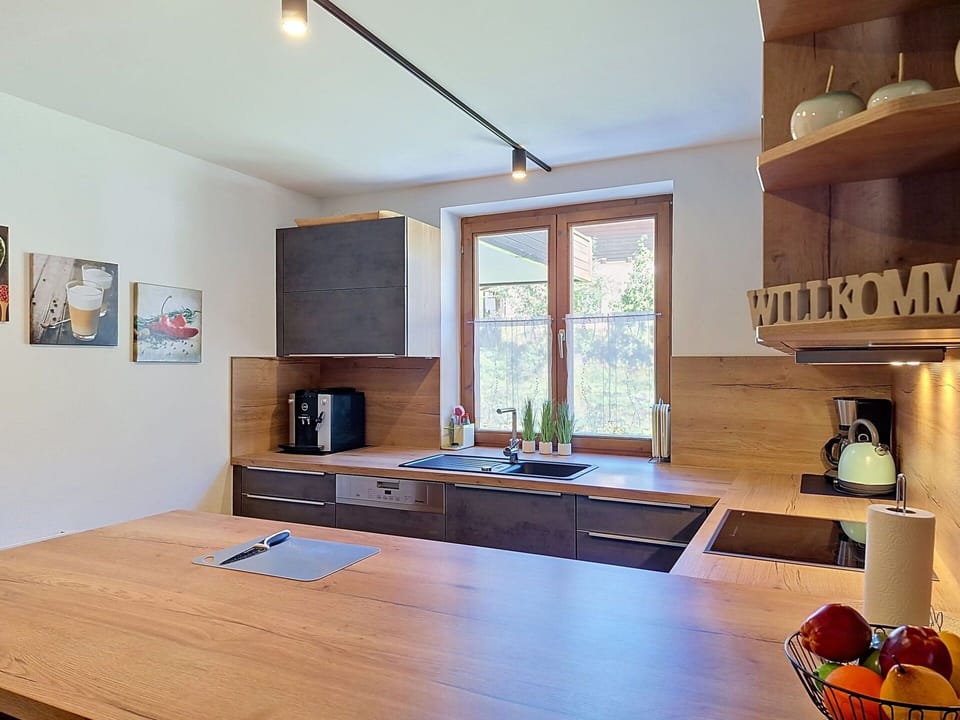 Countertop, Kitchen, Interior Design, Furniture, Flooring, Wood, Light Fixture, Ceiling, Kitchen Appliance, Cabinetry