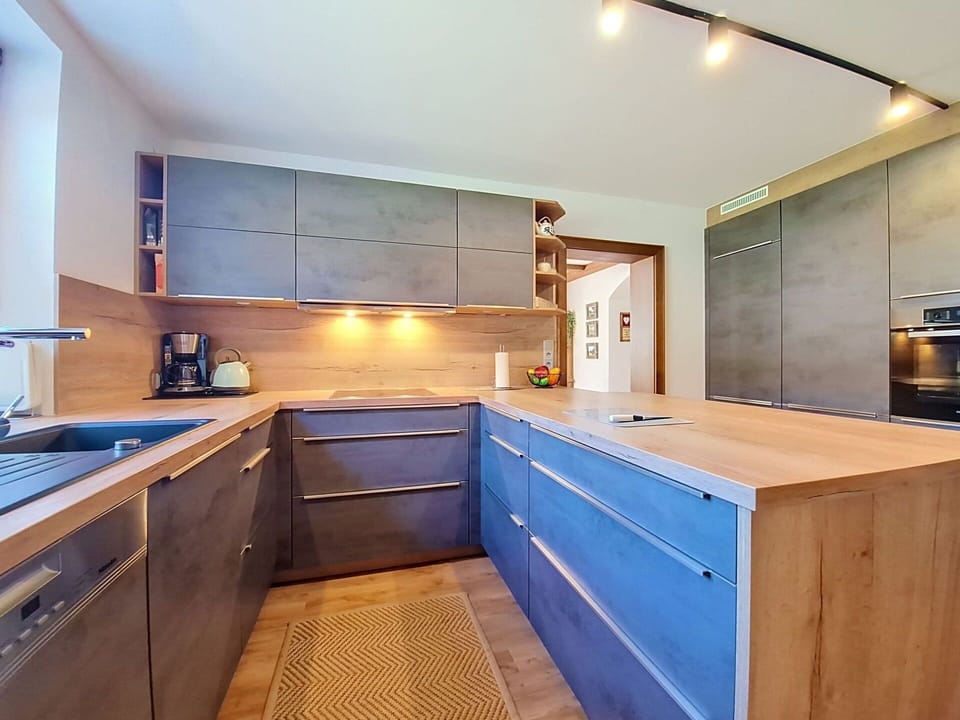 Flooring, Wood, Kitchen, Countertop, Interior Design, Ceiling, Furniture, Floor, Cabinetry, Kitchen Appliance