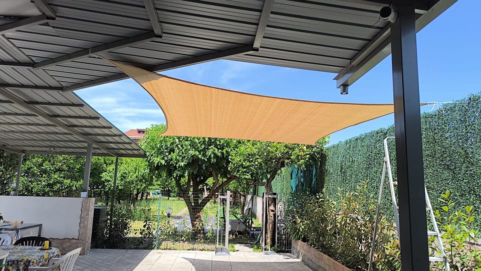 Small house with a garden, parking space, gazebo, tables, chairs, and an outdoor kitchen. Villa in Campania