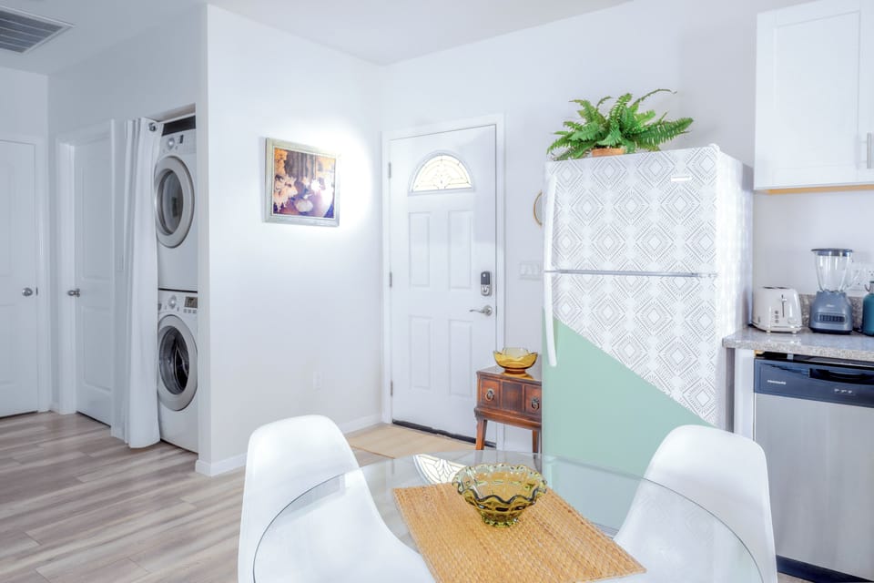Open plan dining area and kitchen. Hidden in-unit laundry.