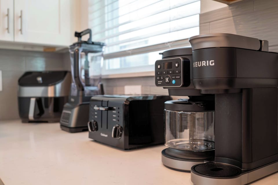 Fully equipped kitchen with countertop appliances & cooking essentials