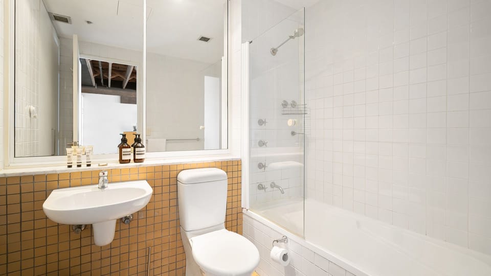 A crisp white bathroom with a fresh, modern feel.