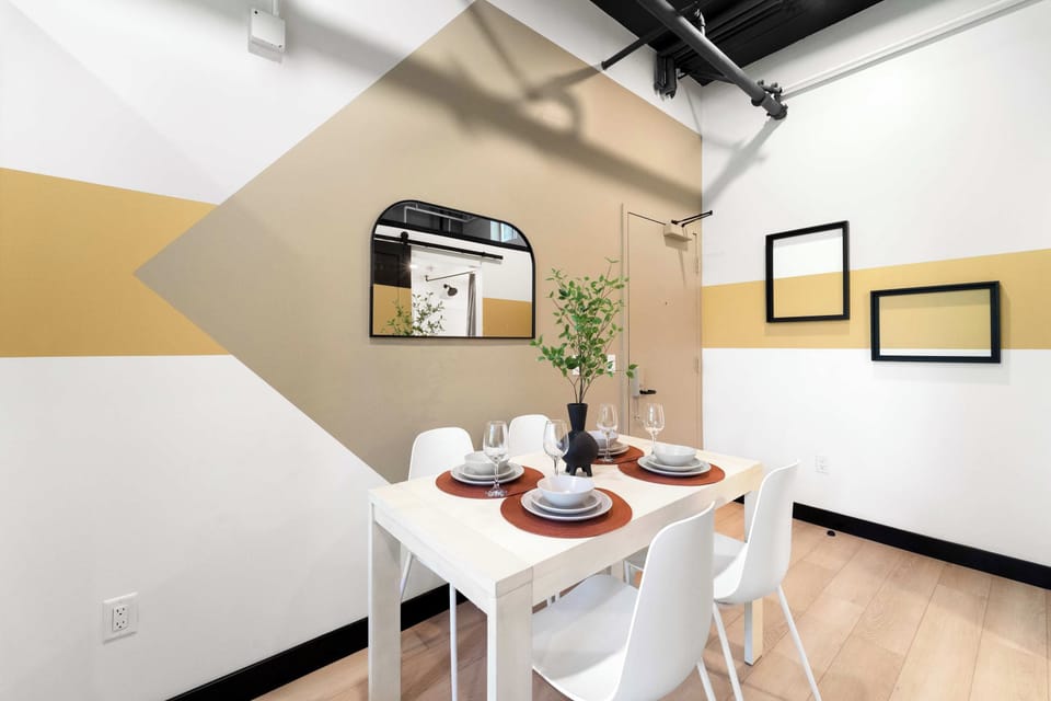 🍽️ Compact dining nook with warm geometric accents—a stylish spot for a quick meal or morning coffee.