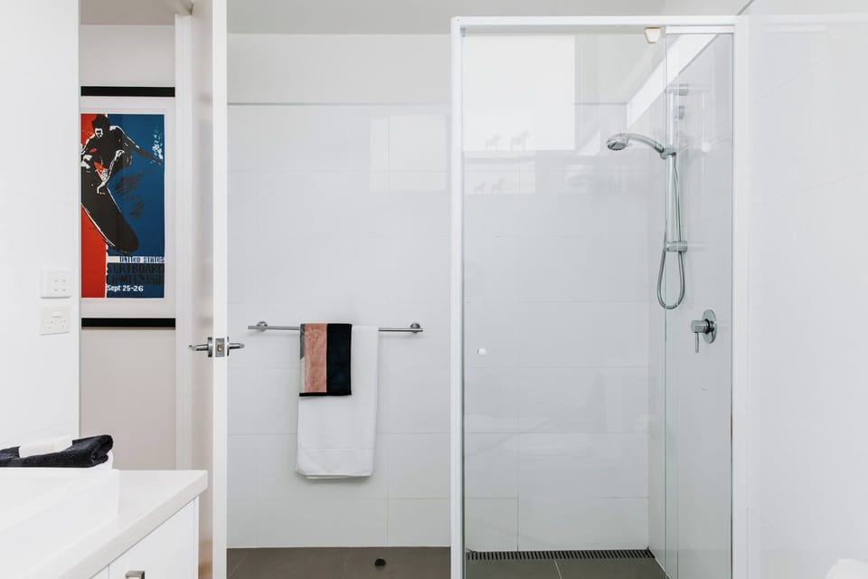 the large shower in the family bathroom