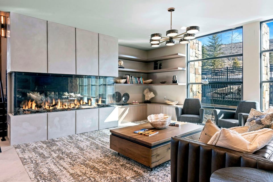 Warm lobby lounge with a fireplace and mountain-lodge decor