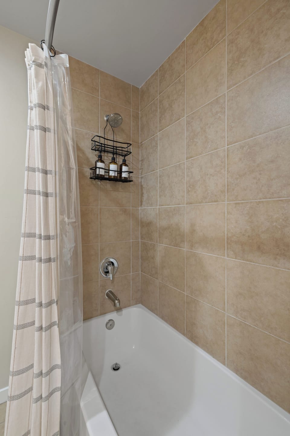 The guest bathroom offers a bathtub and shower. 