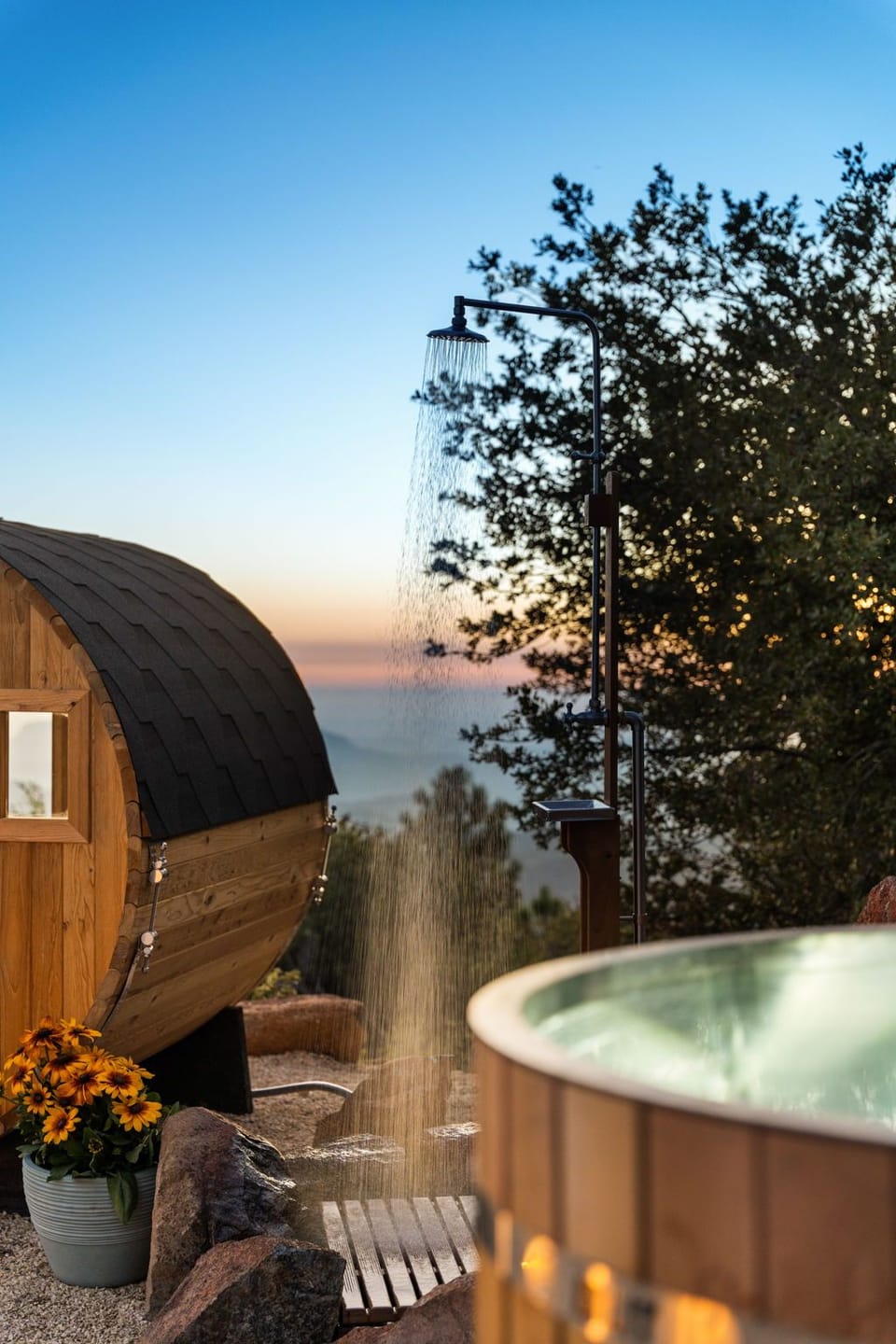 The outdoor shower sits beside the sauna and cold plunge so you can rinse off in between sessions.