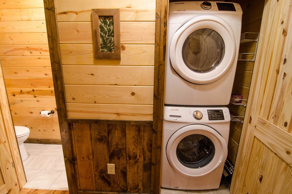 Convenient in-unit washer/dryer with warm rustic cabin charm