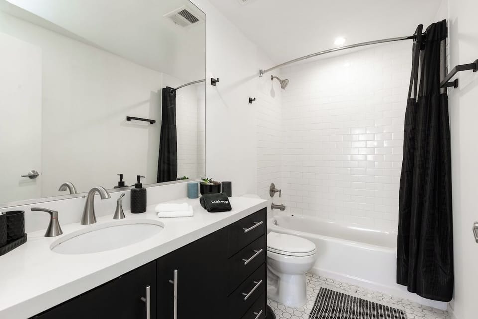 Spacious and bright bathroom with everything you need for a comfortable stay