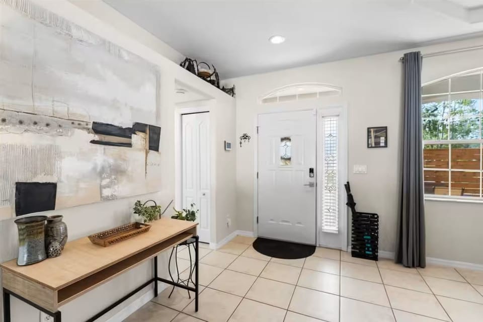 Bright, stylish entryway with natural light and modern decor