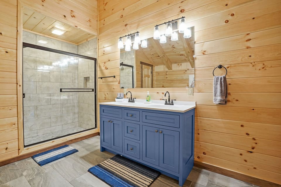 Blue vanity and glass shower
