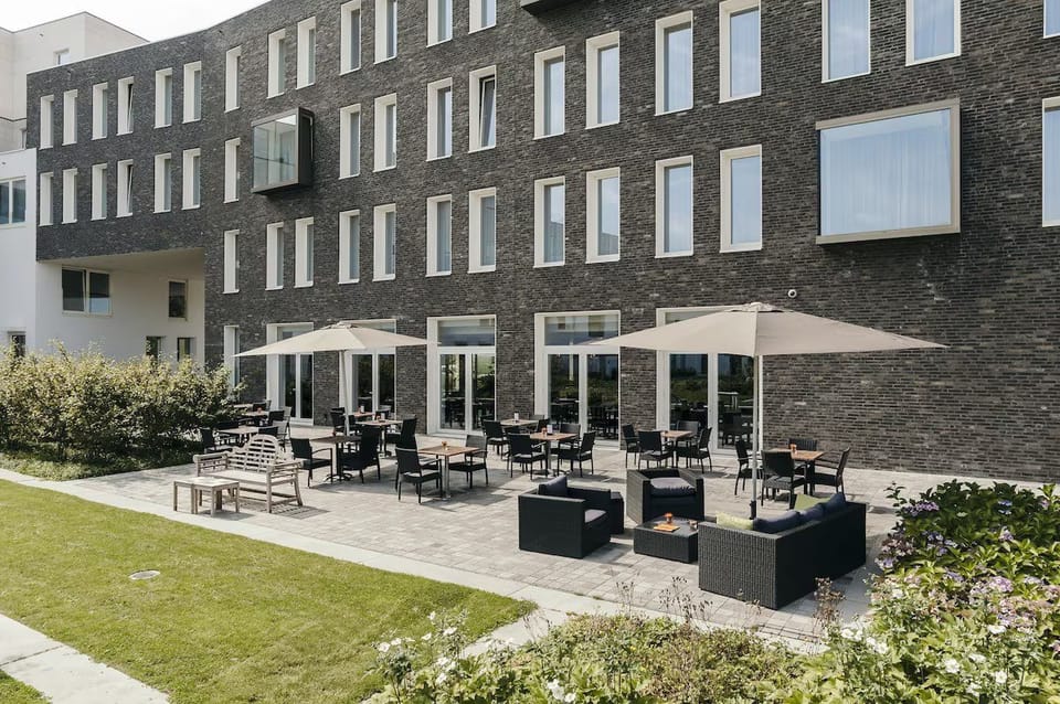 Lounge outdoors with drinks under umbrellas on the sunny terrace