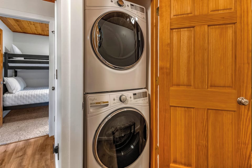 Tuck your travel clothes right in and let the stacked washer and dryer handle the rest. You'll have fresh outfits ready in no time, making your stay effortless and carefree.