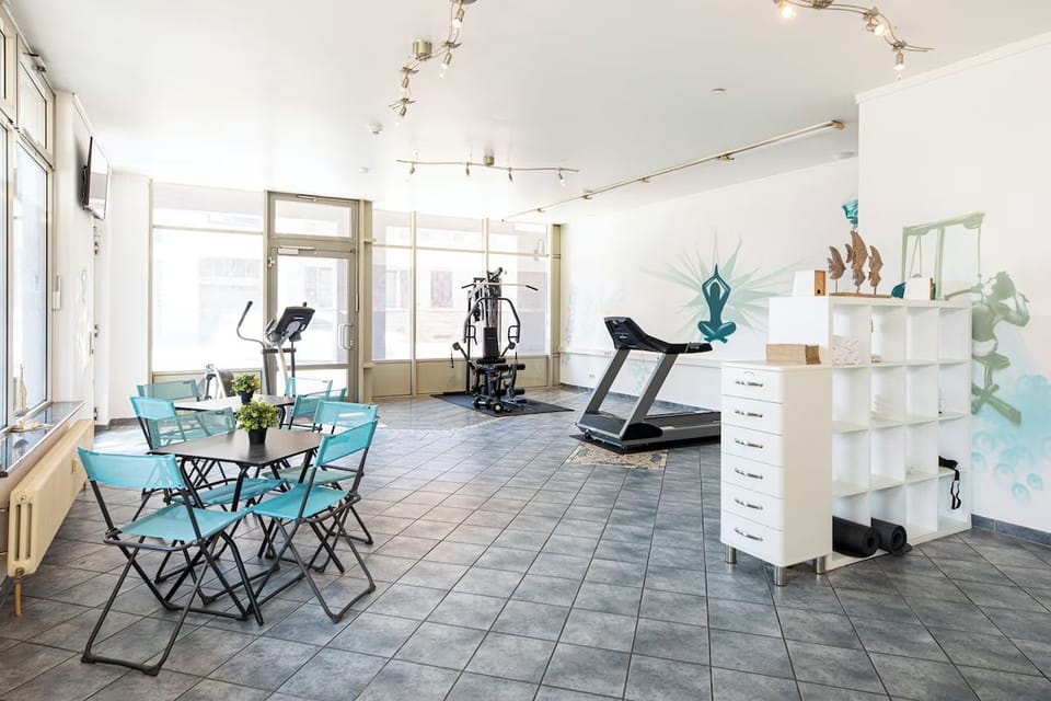 Recharge with an energizing workout in the airy fitness room.