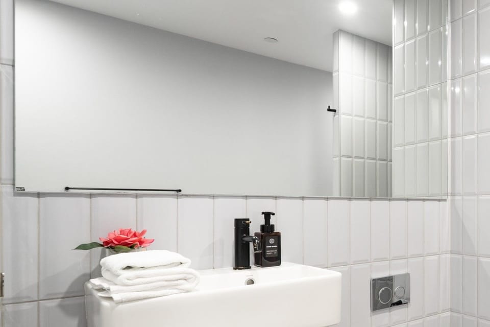 Bright, fresh and beautifully appointed, this bathroom offers a clean and comfortable space to refresh and get ready for the day.