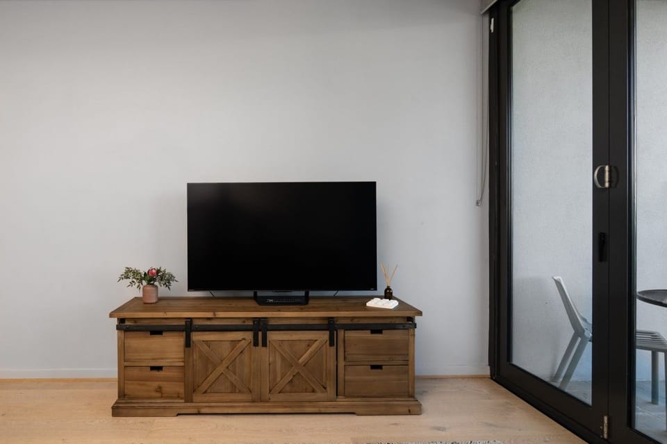 A welcoming living space with a comfortable lounge and entertainment area, perfect for putting your feet up after a day of exploring.