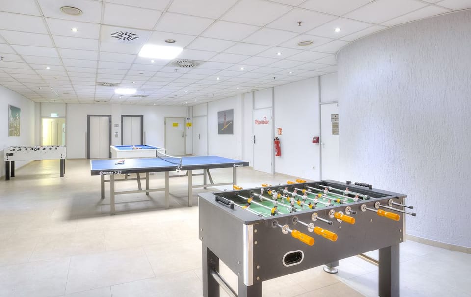 Challenge friends to foosball and table tennis for playful evenings.
