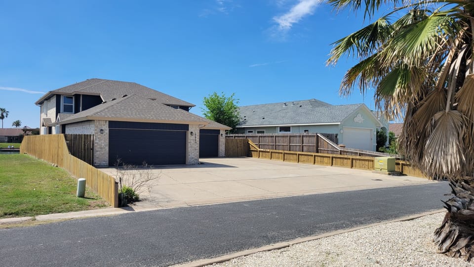 Spacious driveway for vehicles and boat trailers!