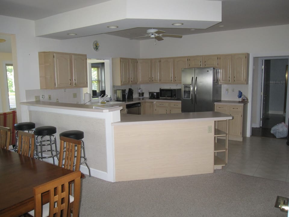 Kitchen opened to great room.  Stools to sit-up at kitchen counter.