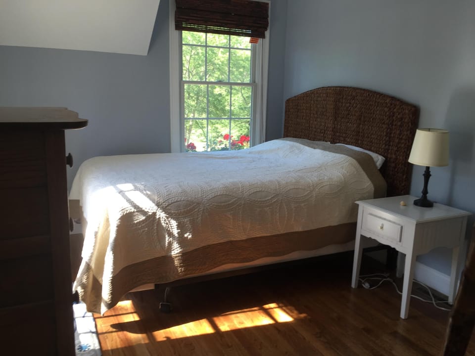Guest quarters bedroom (with queen bed and access to small private deck)
