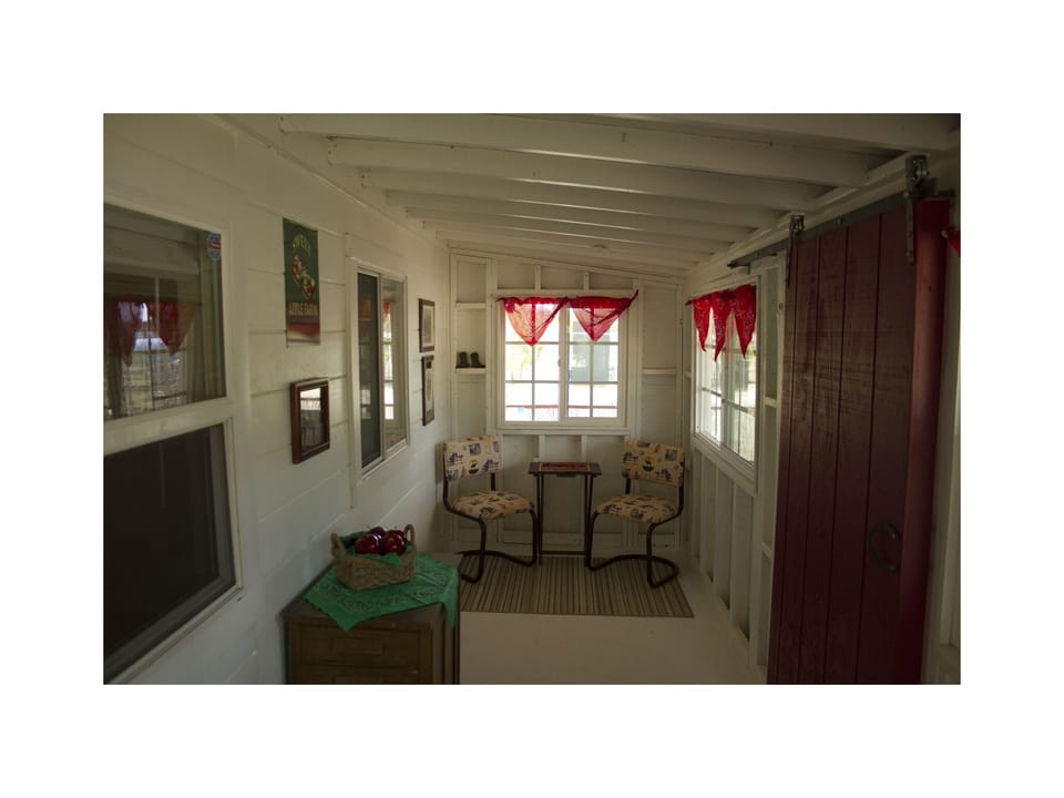 The breezeway has a barn door that exits to the backyard.  Checkers anyone?
