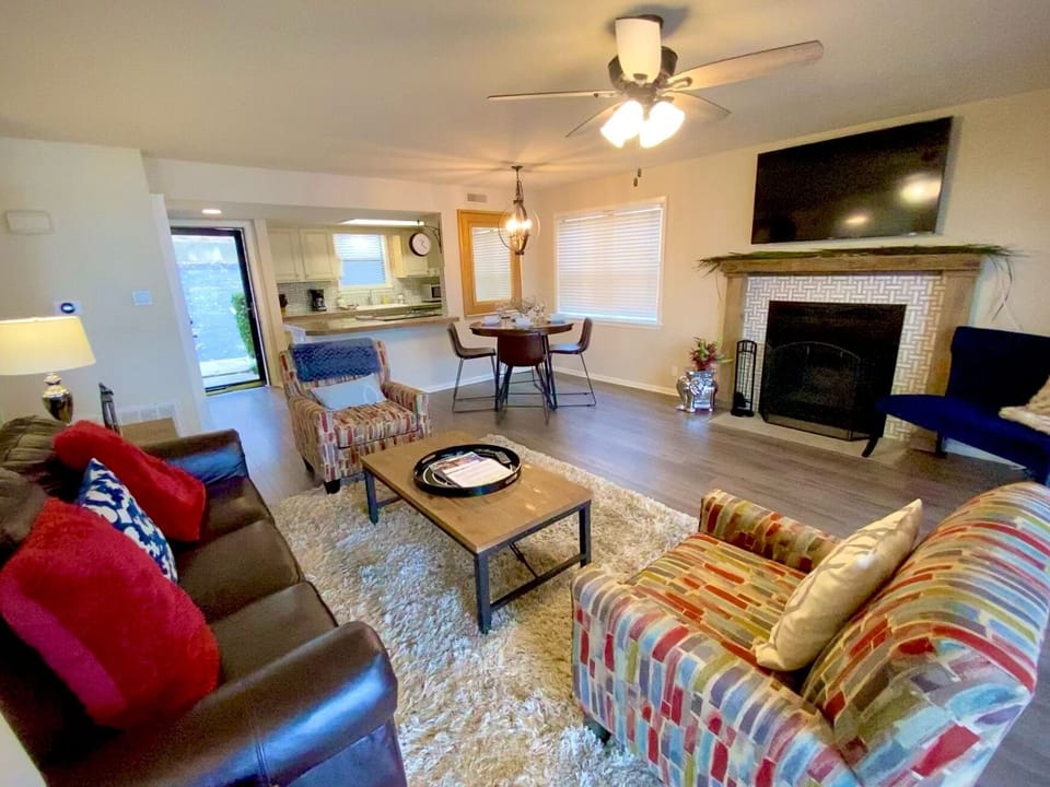 Cozy living room with a wood-burning fireplace for you and your guests.