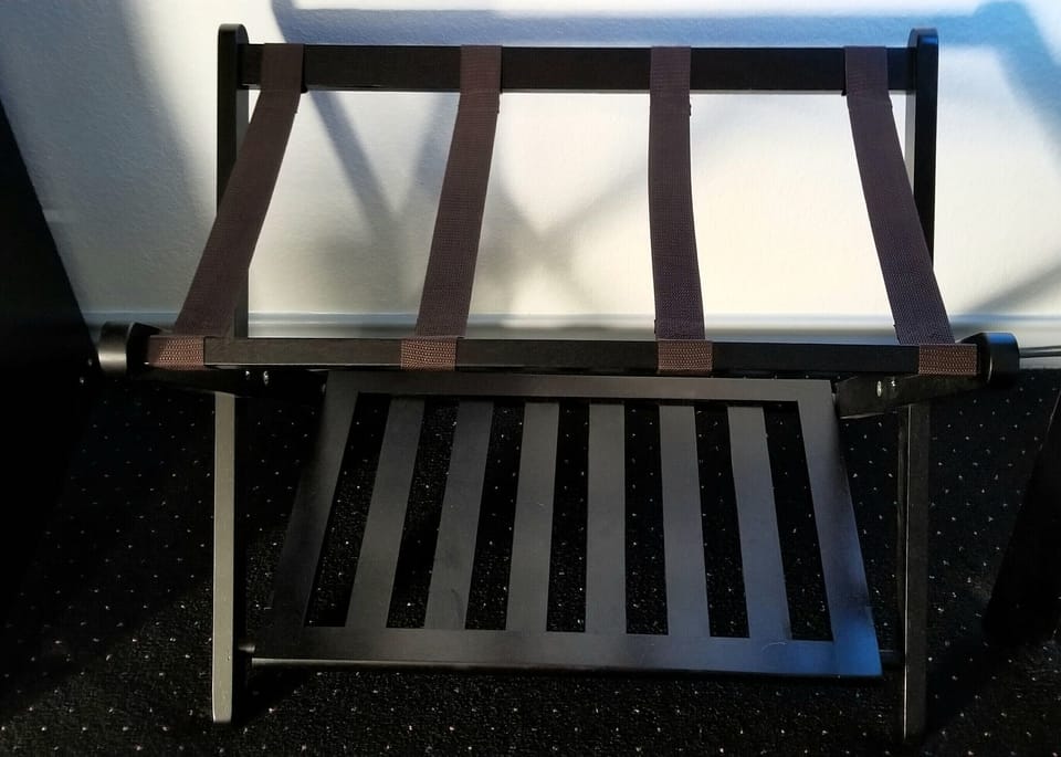 Luggage rack with lower storage for another suitcase or shoe storage