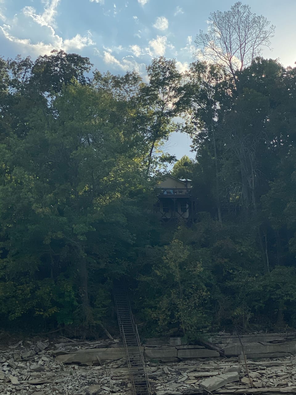 View of house and stairs from Water. 