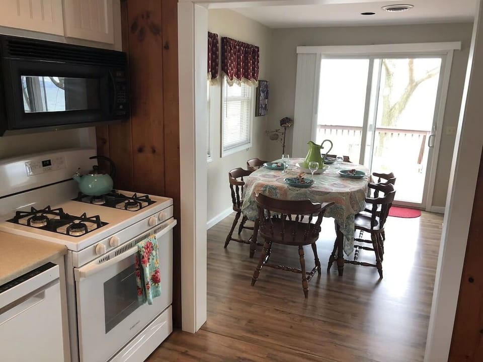 Kitchen looking to dining area with lake views